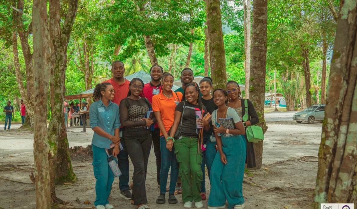 Image of a group of people standing in a wooded area at Conclave 2025 Event