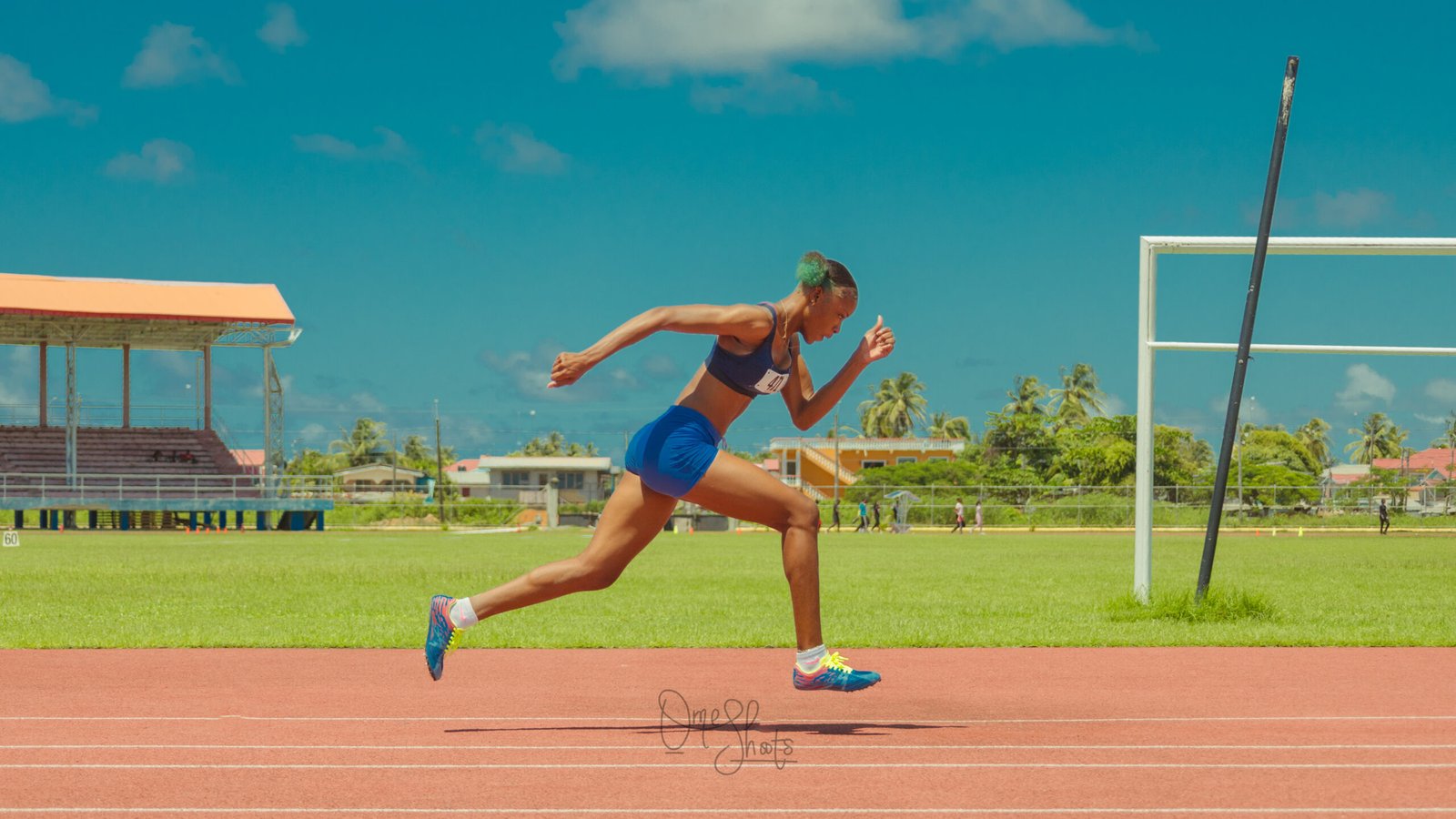 A female running frozen with both feet suspended in the air